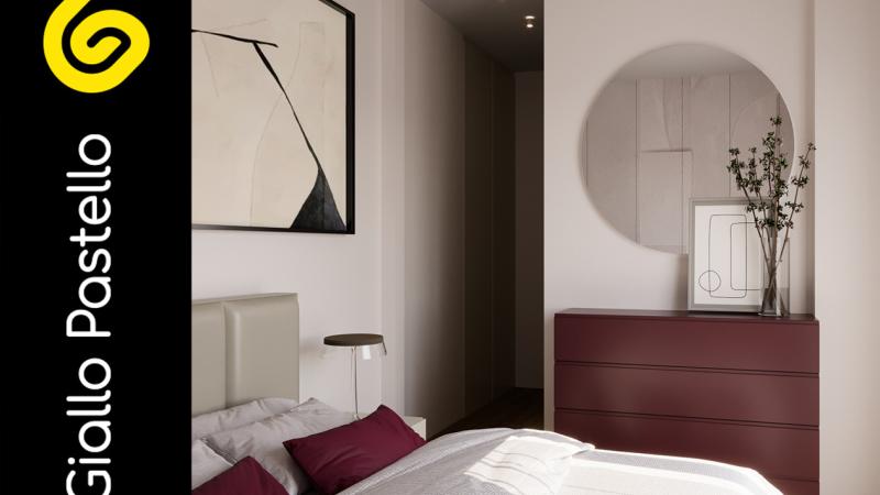 Camera da letto rossa - Arredamento bilocale: un nuovo charme per questo appartamento in città - Giallo Pastello