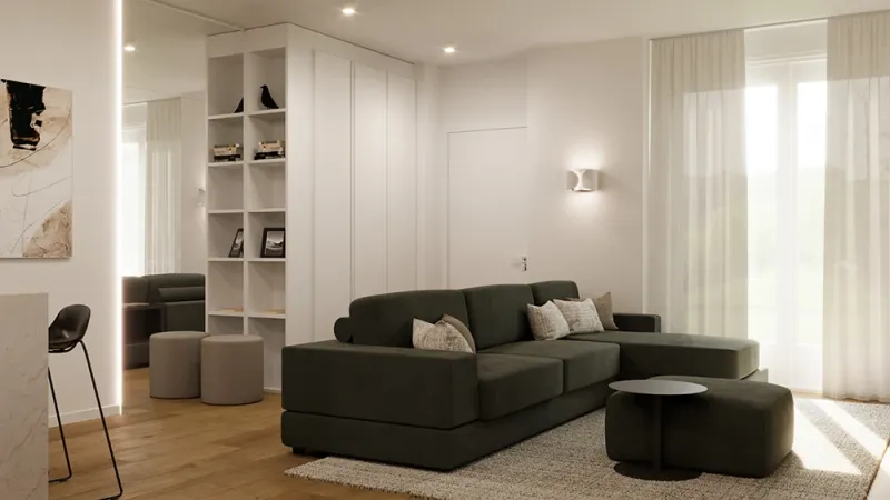 Arredamento Open Space: zona con divano e scaffali - Giallo Pastello Interior Design